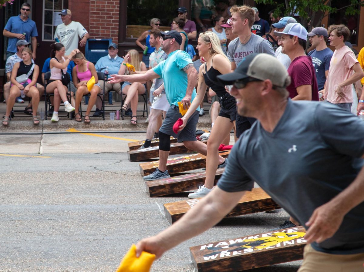 People compete in the beanbag toss tournament at Heritage Days. The tournament was run by the Mount Vernon high school wrestling team.