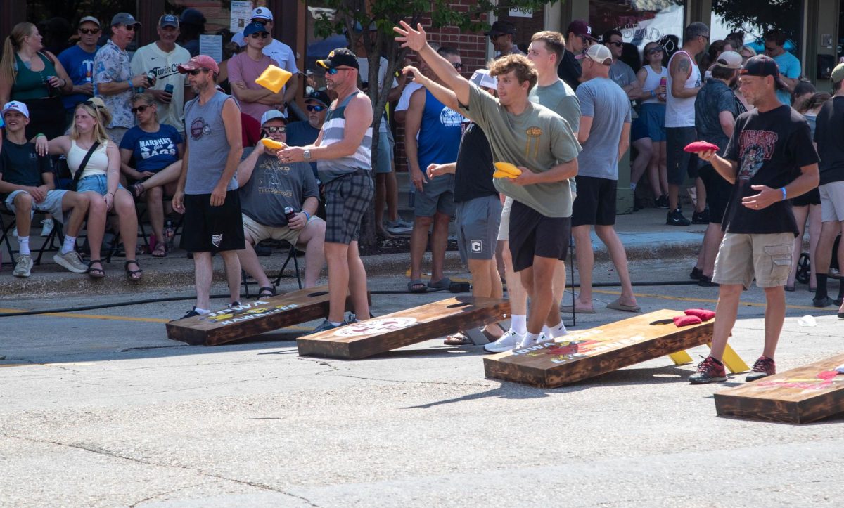 People compete in the beanbag toss tournament at Heritage Days. The tournament was run by the Mount Vernon high school wrestling team.