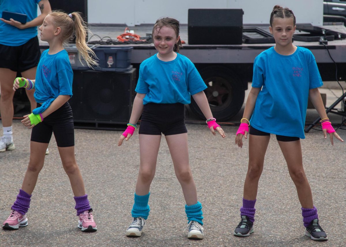 Dance Arts Iowa dance group performed on Main Street on Saturday, during the festival. The group was made up of a range of elementary school-aged kids and four coaches. They battled through technical difficulties during the beginning of the show, with the sound system not working. They audibled to using a bluetooth speaker and the dancing went on.