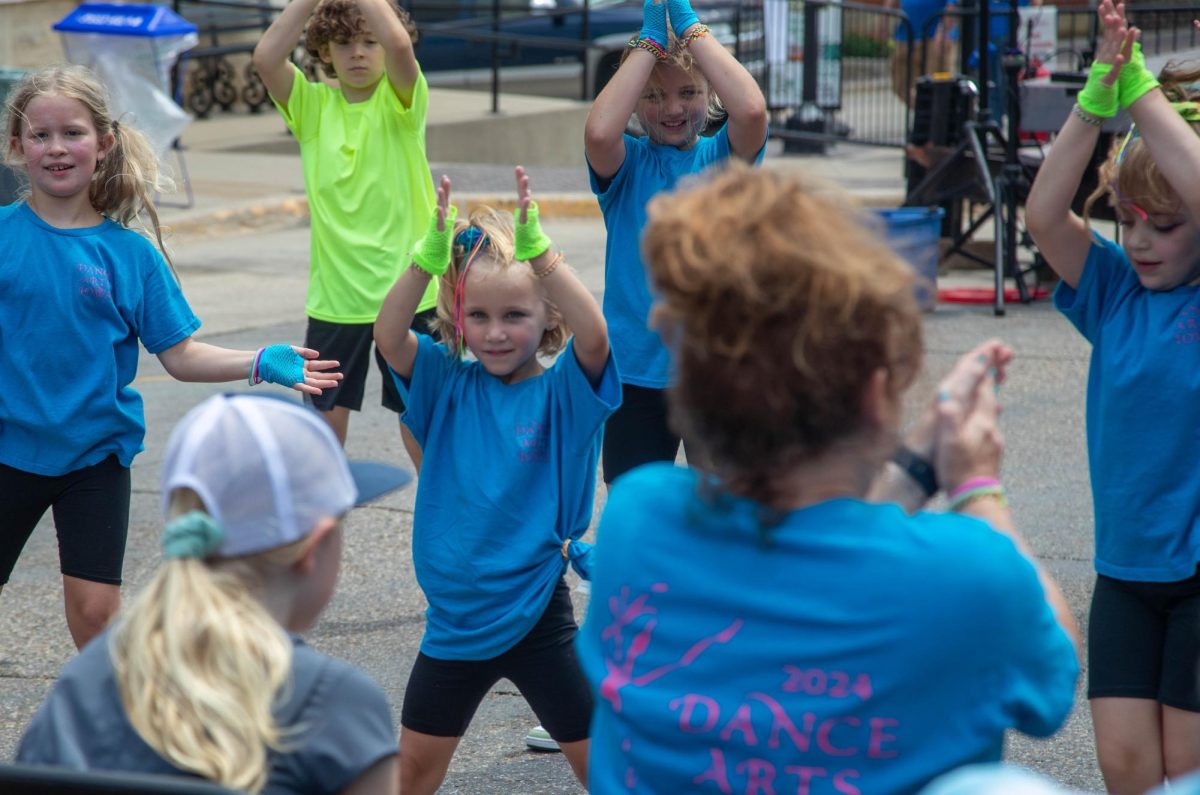 Dance Arts Iowa dance group performed on Main Street on Saturday, during the festival. The group was made up of a range of elementary school-aged kids and four coaches. They battled through technical difficulties during the beginning of the show, with the sound system not working. They audibled to using a bluetooth speaker and the dancing went on.