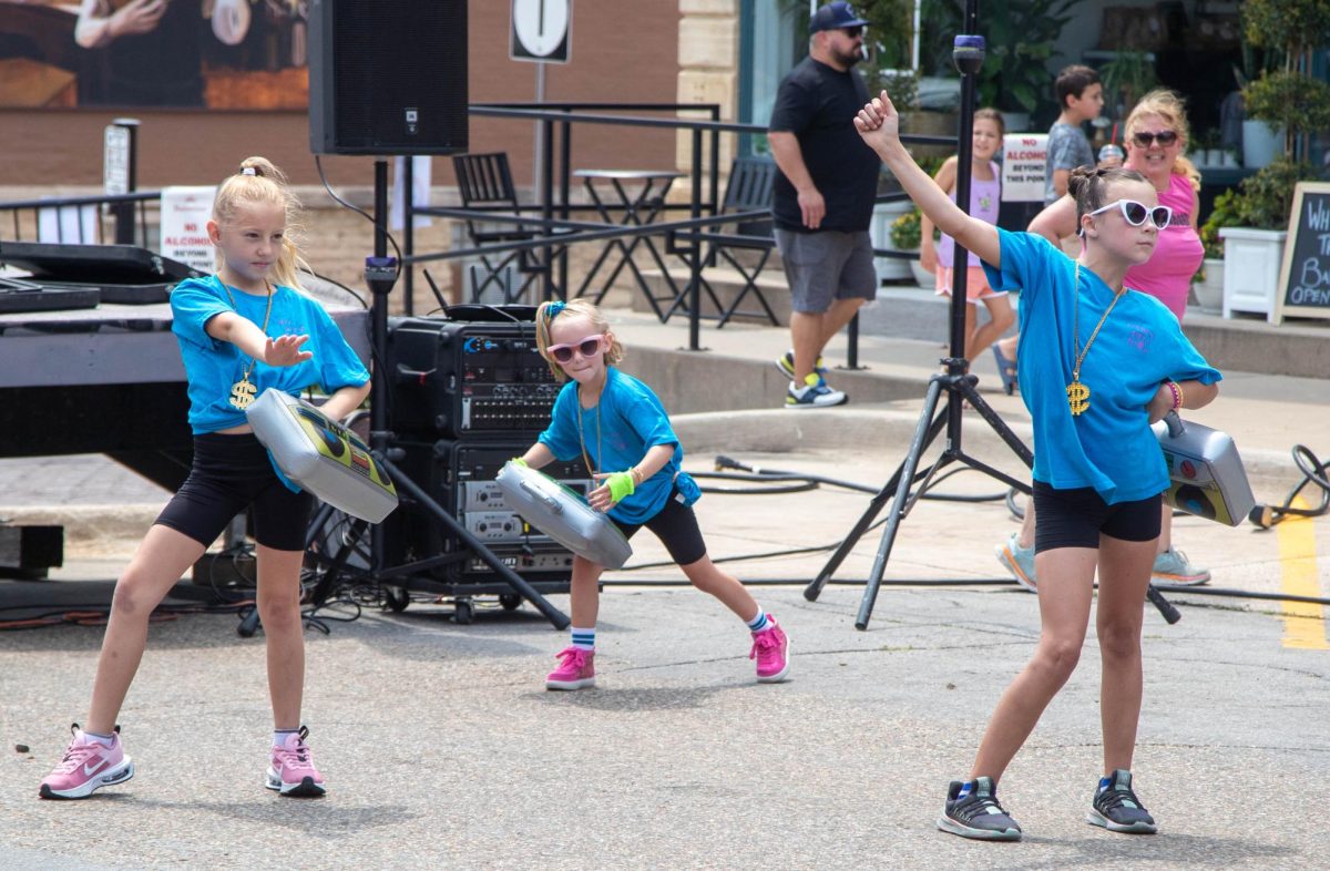 Dance Arts Iowa dance group performed on Main Street on Saturday, during the festival. The group was made up of a range of elementary school-aged kids and four coaches. They battled through technical difficulties during the beginning of the show, with the sound system not working. They audibled to using a bluetooth speaker and the dancing went on.