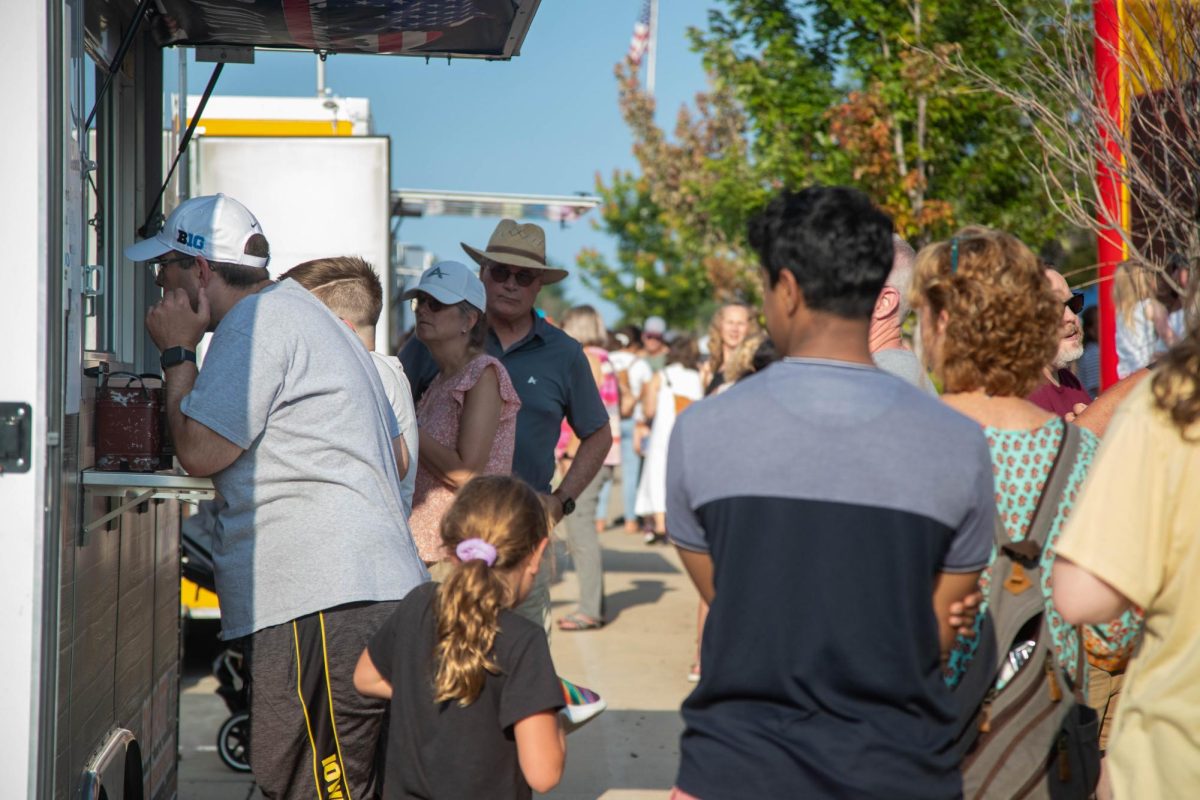 People order food from one of the many food trucks on Friday night. There were many venders selling food and drinks throughout the festival.