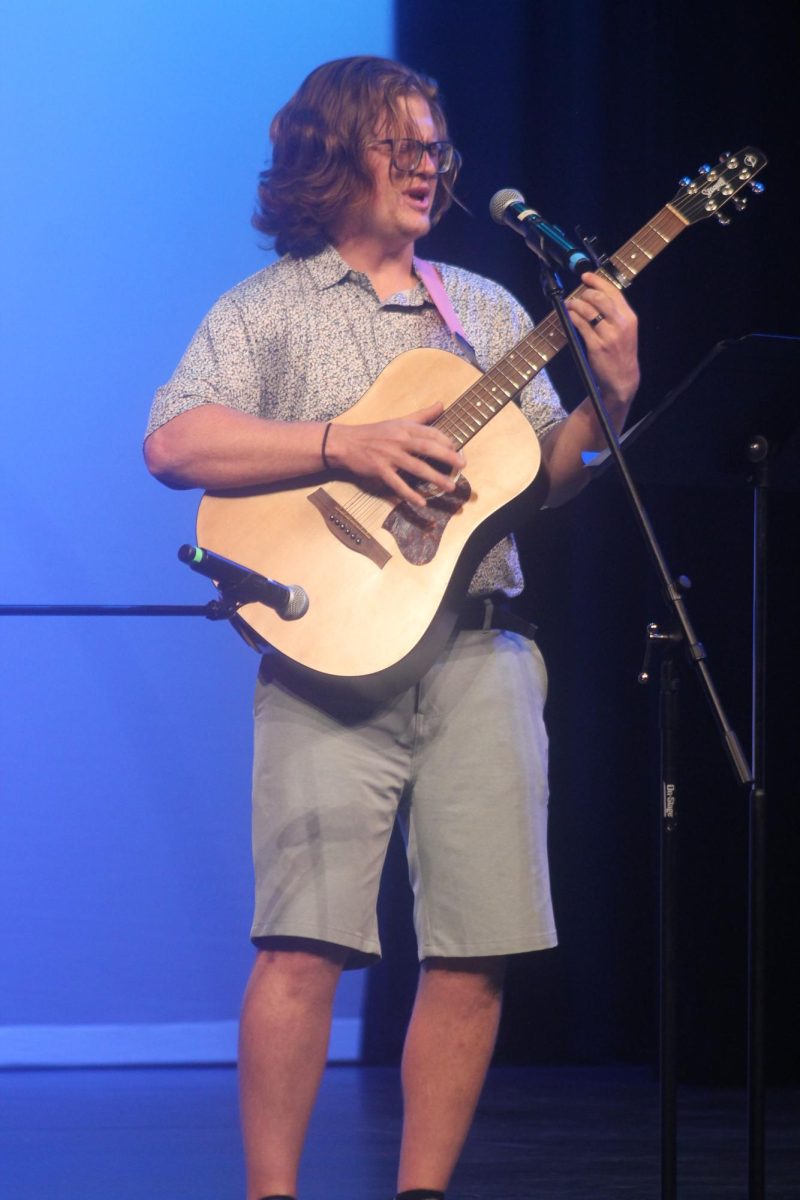 Mount Vernon alum Bryce Cox played guitar and sang a song at the event Friday, July 12. He also demonstrated how he uses his musical talents in science classrooms these days as well. 