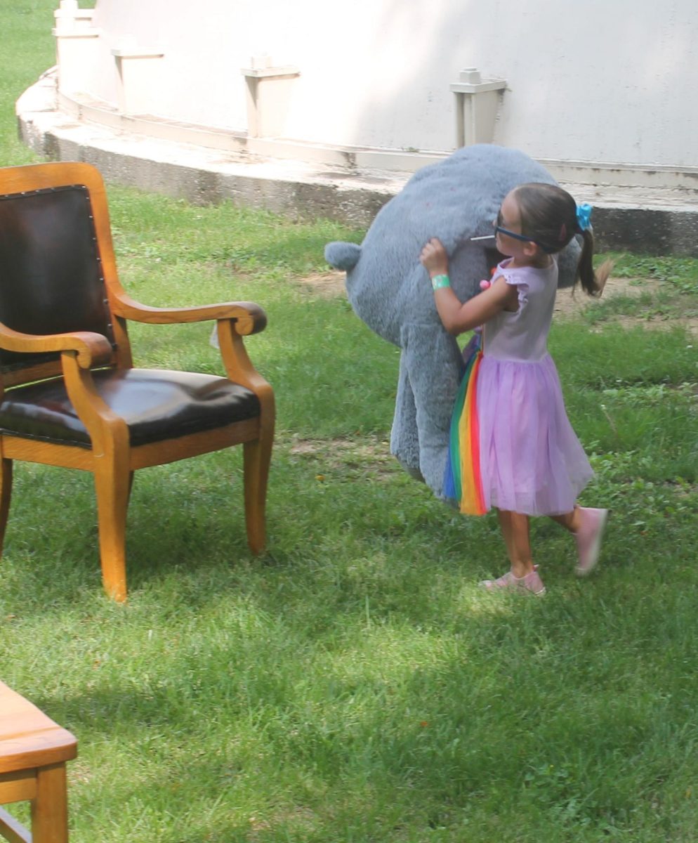 Emma McKendree rushes to place papa bear in the correct chair at the Goldilocks Relay at Memorial Park Fun Zone Saturday, July 13. 