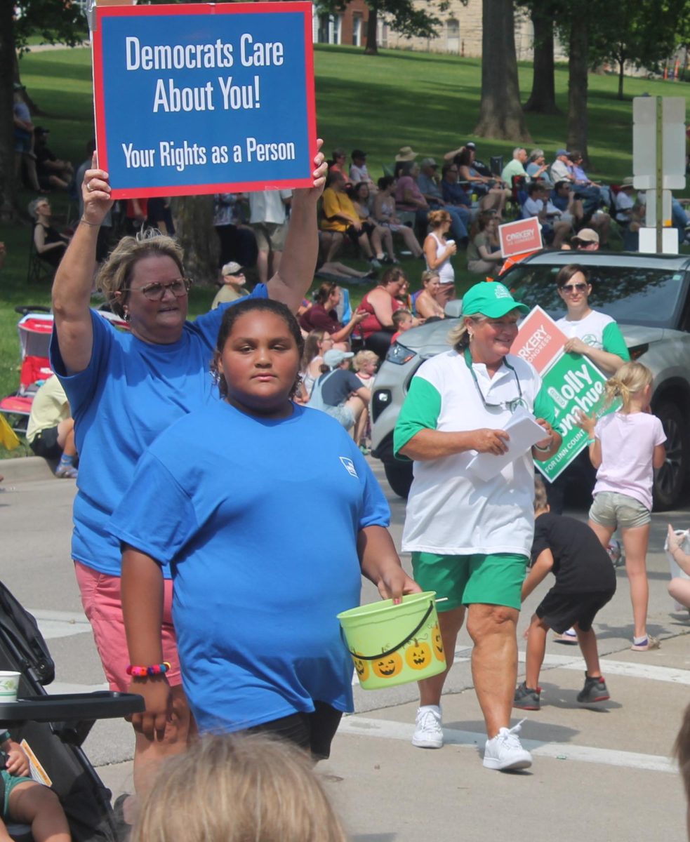 Molly Donahue (right) walks in the Heritage Days parade Saturday, July 12.