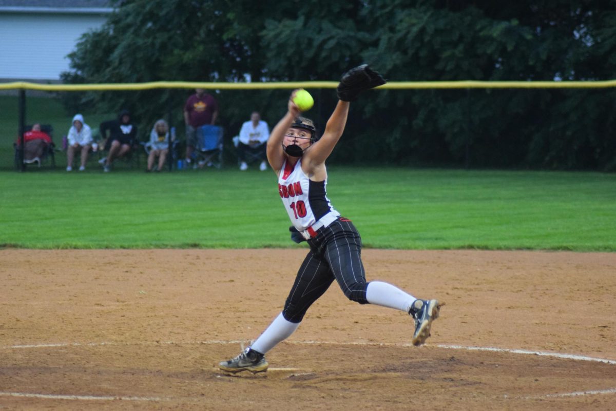 Lisbon pitcher Kyla Kahl prepares to fire the ball to home plate against Denver in a Class 2A regional playoff game Wednesday, July 10, at City Park in Lisbon.