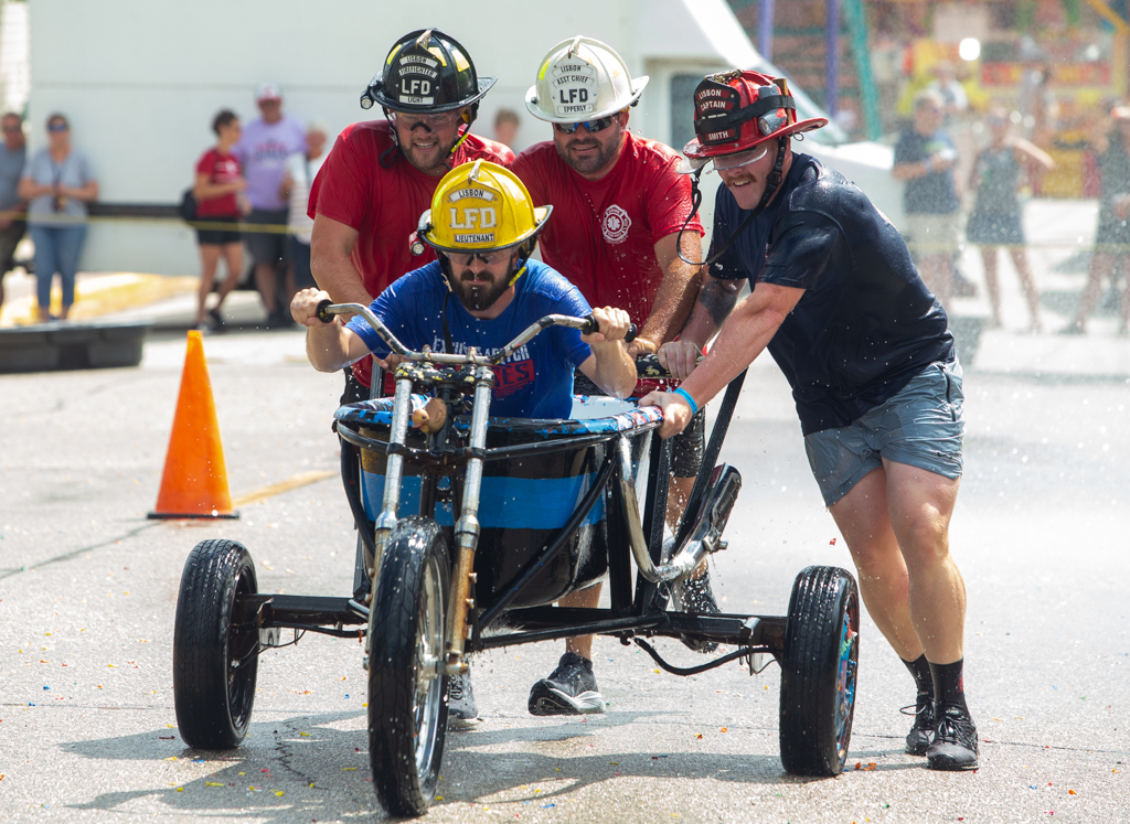 The Lisbon Fire Department team finishes their lap around the track. They placed second in the event with their fastest time being 14.19.