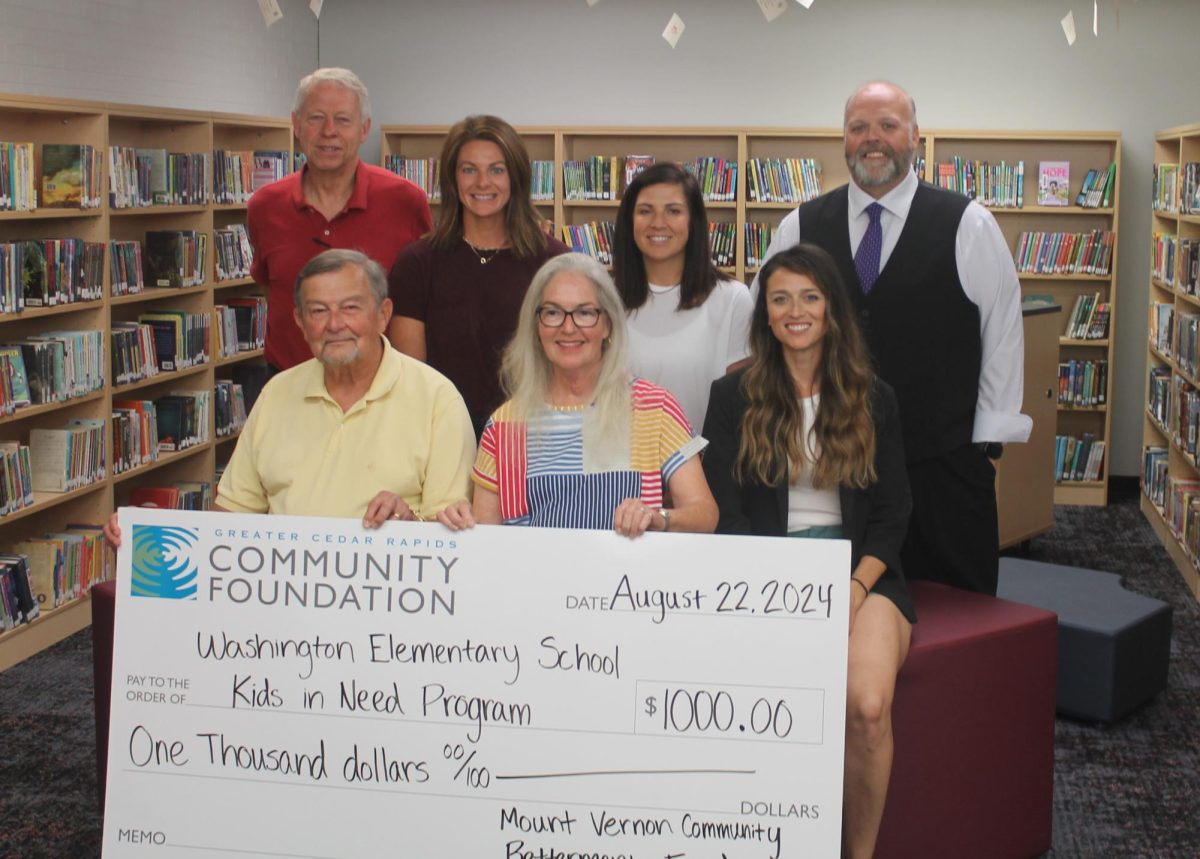 (back, from left) Tom Wieseler, Megan Krapfl, Jenna Wear, Matt Leeman (front, from left) Les Garner, Katrina Garner and Amie Roberts at the distribution of the first community donation for the Washington Elementary Kids in Need program made Thursday, Aug. 22. 