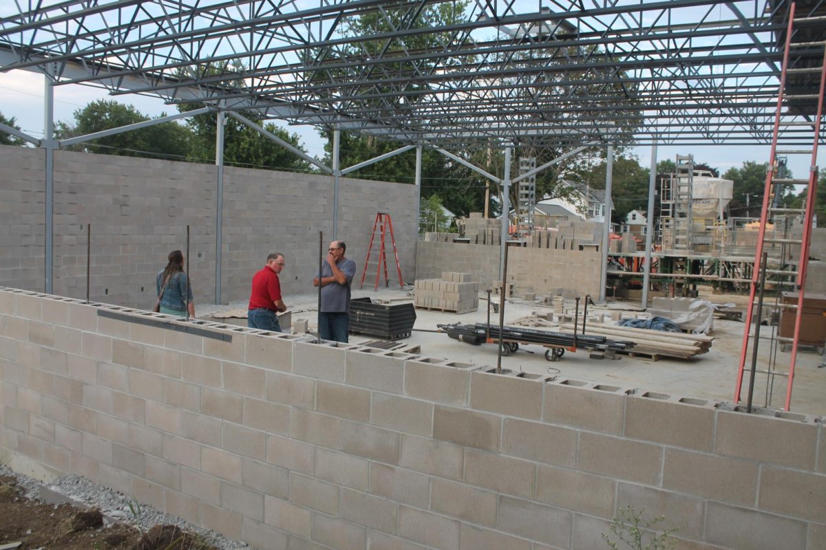 Lisbon School Board members John Prasil, Allan Mallie and Robyn Richey inspect some of the work in the career and technical education wing Tuesday, Aug. 20. 