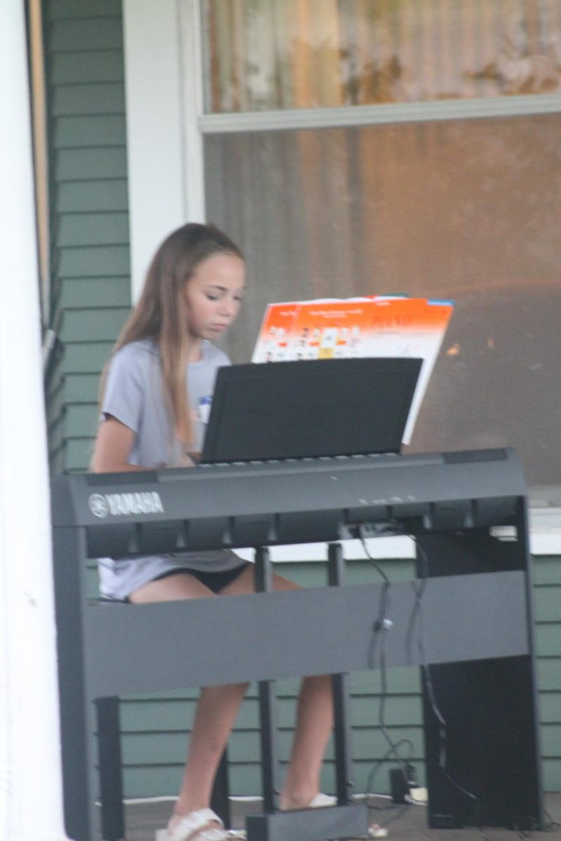 Vivian Andresen performs a piano solo at the talent show.