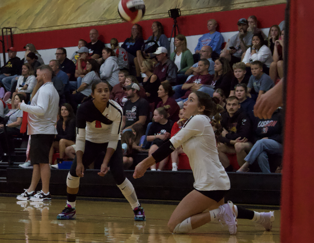 Lisbon volleyball player Aislin Andrews serves the ball at a match between the Lisbon Lions and the Winfield-Mt. Union Wolves on Sept. 5, 2024 at Lisbon High School. The Lions beat the Wolves, 2-1.