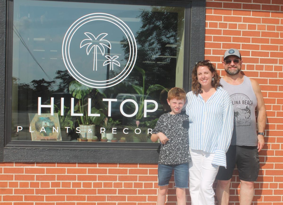 Desmond Bray, Stefanie Bray and Michael Bray outside their shop’s storefront. The grand opening of Hilltop Plant and Records is this Saturday, Sept. 7, from 10 a.m. to 4 p.m.