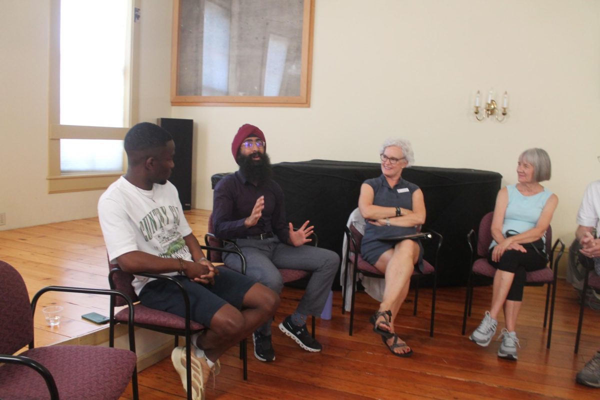 Joshua Musonda (left) and JJ Kapur (middle) were the storytellers for the OpenBook presentation Wednesday, Aug. 28, at Lisbon Library. 
