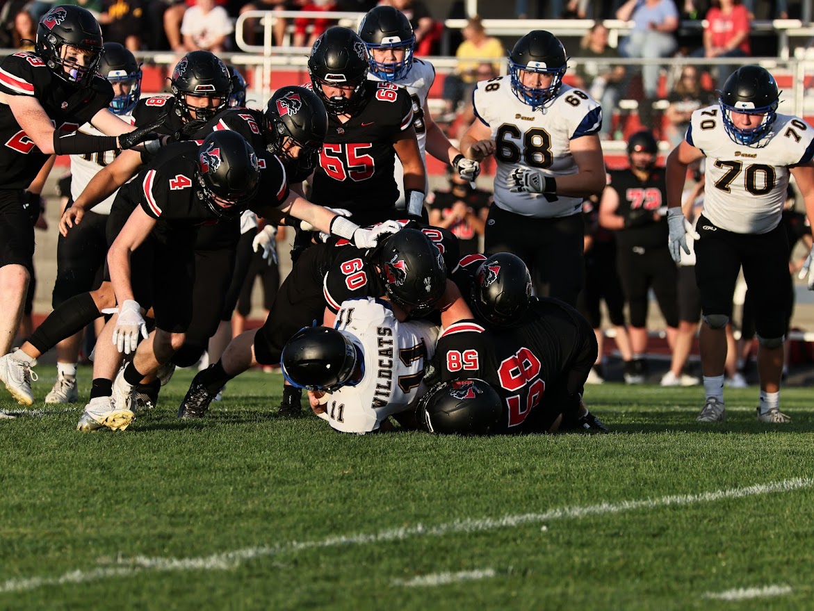 Lisbon’s Evan Coleman (No. 58) and Jacob Walerius (No. 60) tackle a Durant player at Walmer Field Friday, Aug. 30. 
