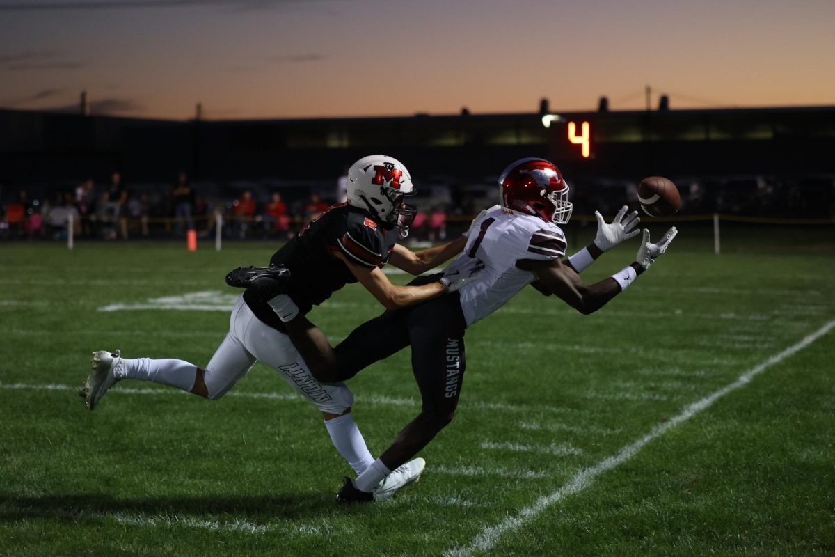 Mount Vernon’s Watson Krob (No. 1) tries to catch the ball before heading out of bounds with a Monticello Panthers defender right behind him.