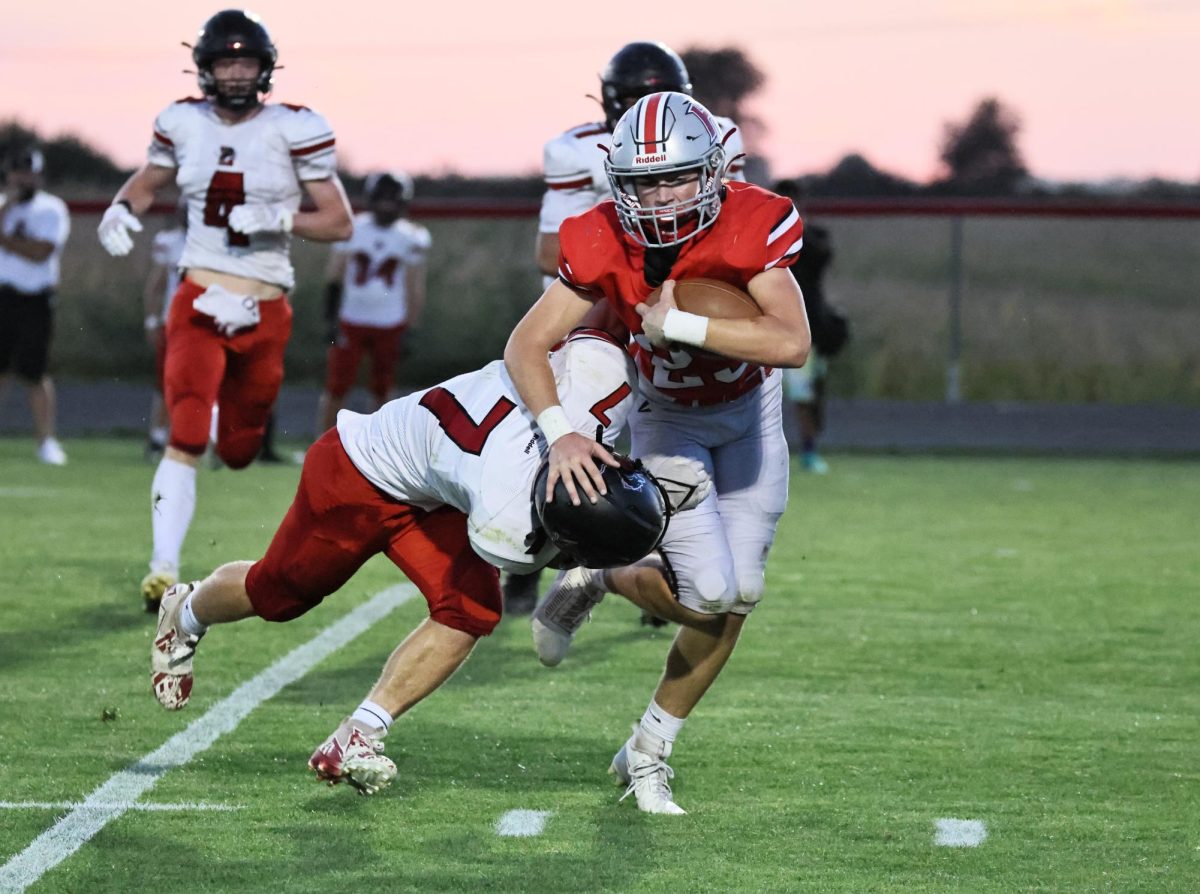 Lisbon’s Tiernan Boots (No. 7) works on tackling a Highland player.