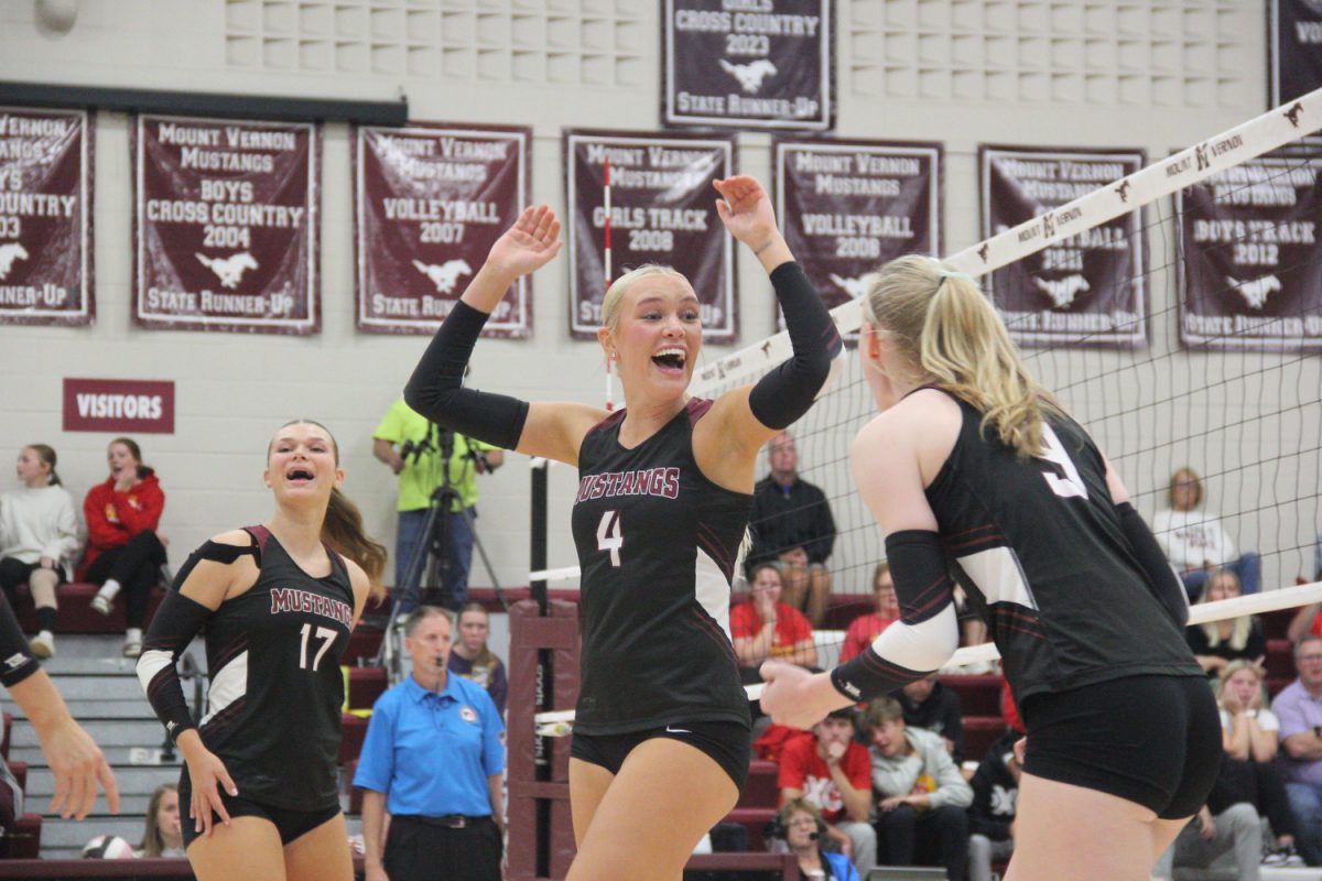 Mount Vernon’s Paige Schurbon (No. 4), Sophia Meester (No. 17) and Sydney Maue (No. 9) celebrate a point. 