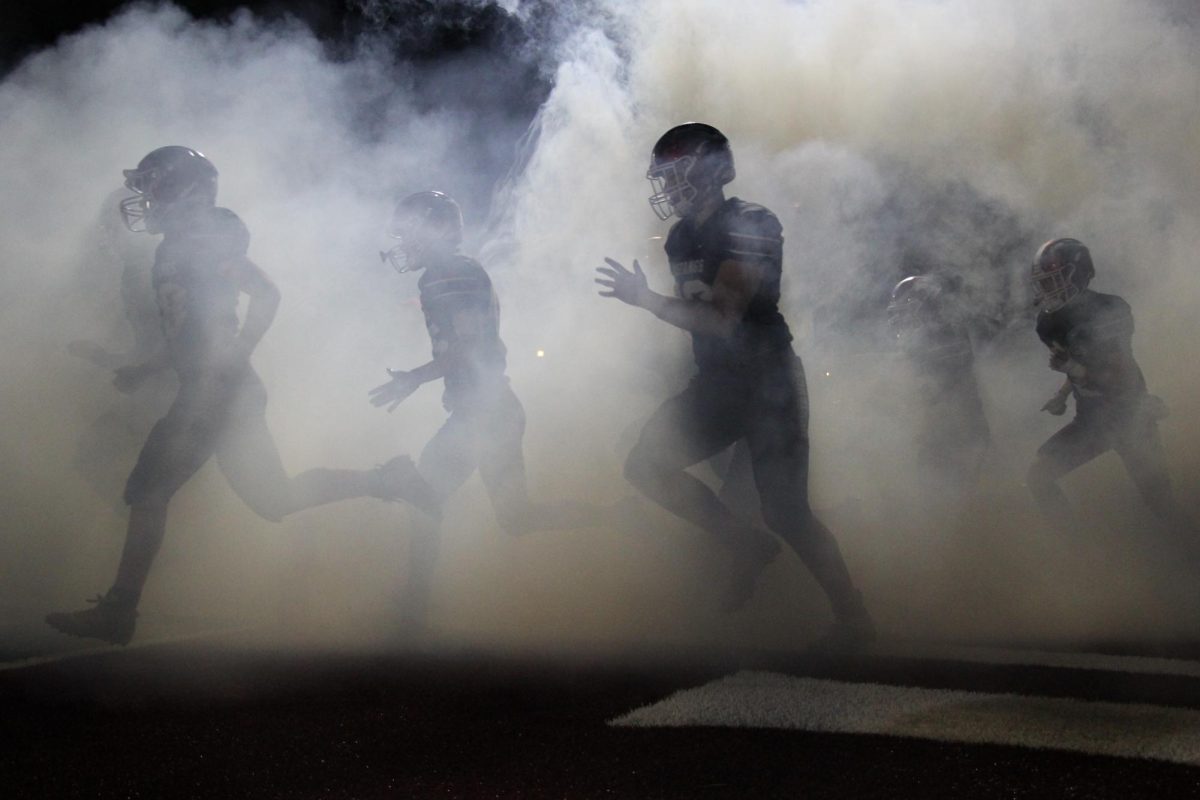 Members of the Mount Vernon football team enter the field before a game against Keokuk at Mount Vernon High School on Oct. 25, 2024. The Mount Vernon Mustangs beat the Keokuk Chiefs, 62-7.