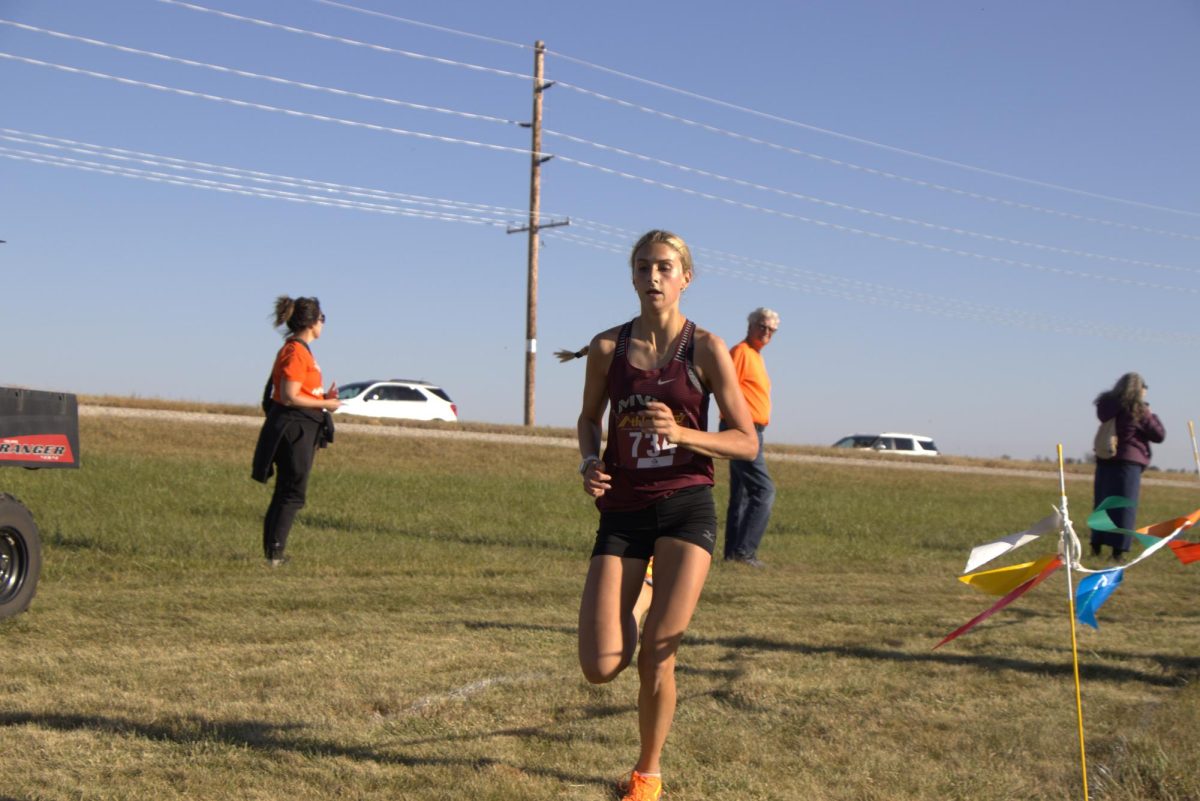 Sophomore Evelyn Moeller finishes second overall in girls’ varsity race, leading Mount Vernon-Lisbon to a team victory and conference championship.