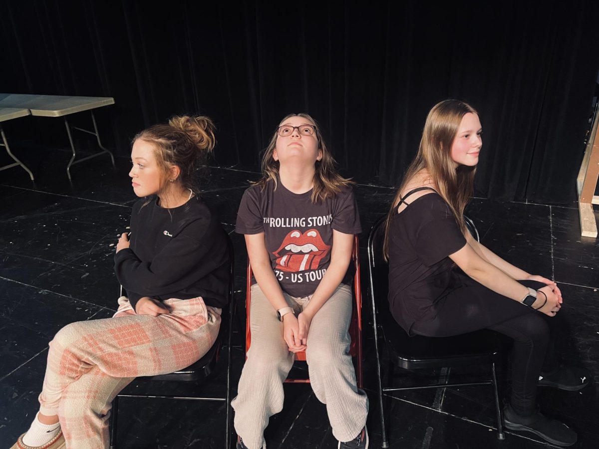 Caroline Morris, Joey Watson and Aubrey Ford act in a scene from We’re All Chickens.