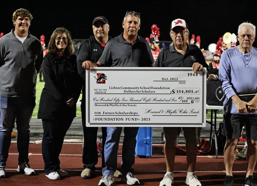 Ciha check distribution (from left) Payton Donohoe, Andrea Hasselbusch, Tracy Bergmann, Sean Miller, Gary Ciha and Mike Jones were present for the Ciha check presentation at Lisbon Schools.