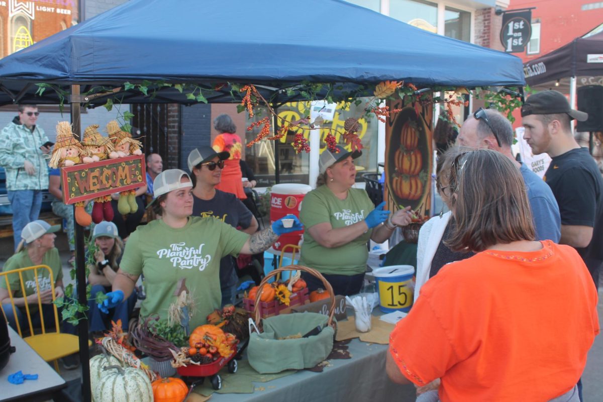 The Plantiful Pantry crew serves up a sampling of their chili Saturday, Oct. 19. The crew won for best theme at the event.