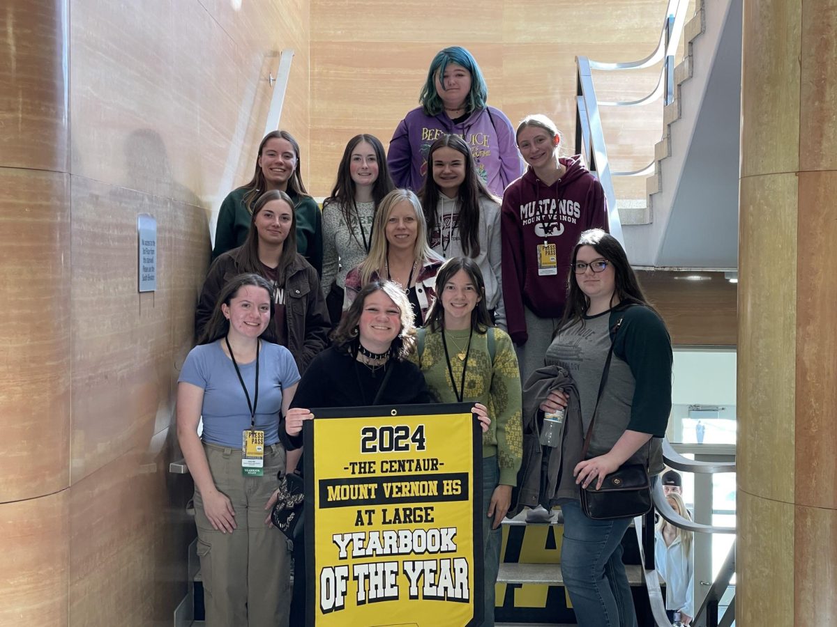 Members of the 2024-25 yearbook staff include - Emily Giel, Kade Kaiser, Lydia Marshall, Rylee Gerber. (middle, from left) Audrey Vaughn, adviser JoAnn Gage, (back from left) Renee Vig, Avery Thurn, Caroline Rupe, Izabella Nelson, and Lucy Wischmeyer.