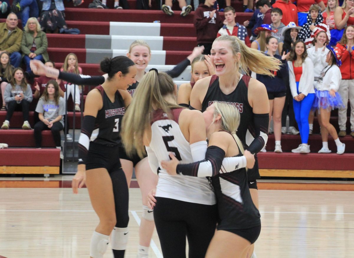 The Mustangs celebrate a point on the court at play at home last week.