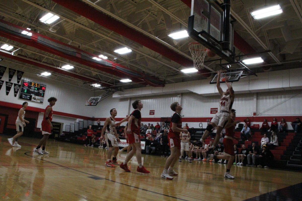 Lisbon Lion Ethan Stone shoots the ball during a basketball game between Lisbon and Marquette Catholic at Lisbon High School on Dec. 6, 2024. The Lions defeated the Defenders, 45-27.