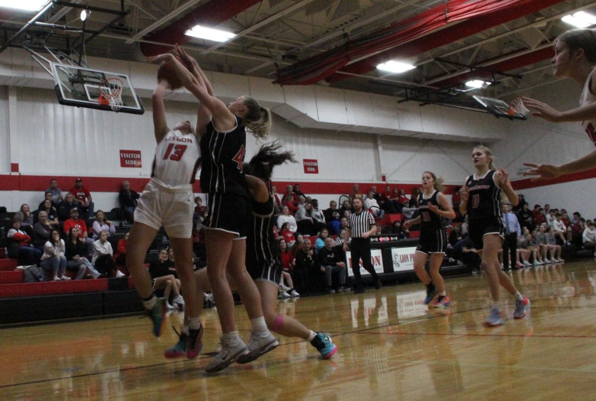 Lisbon Lion Kyla Kahl shoots the ball during a basketball game between Lisbon and Marquette Catholic at
Lisbon High School on Dec. 6, 2024. The Lions fell to the Defenders, 43-62.