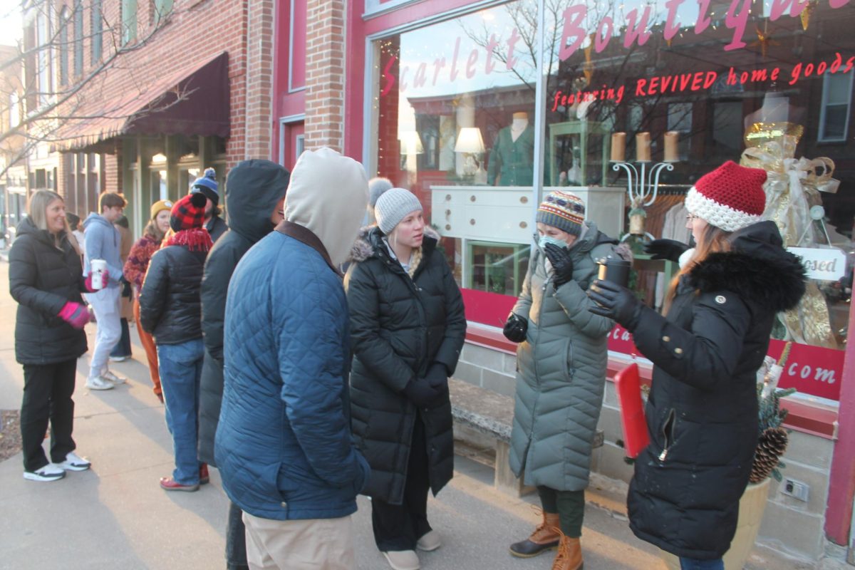 The crowd of roughly 50 people line up for their gift baskets Saturday, Nov. 30