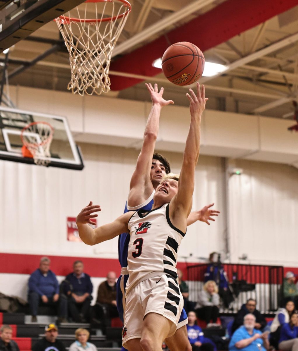 Lisbon’s Dakota Clark (No. 3) scrambles for a rebound against Prince of Peace Jan. 7. (Jennifer Tischer | Contributed photo)