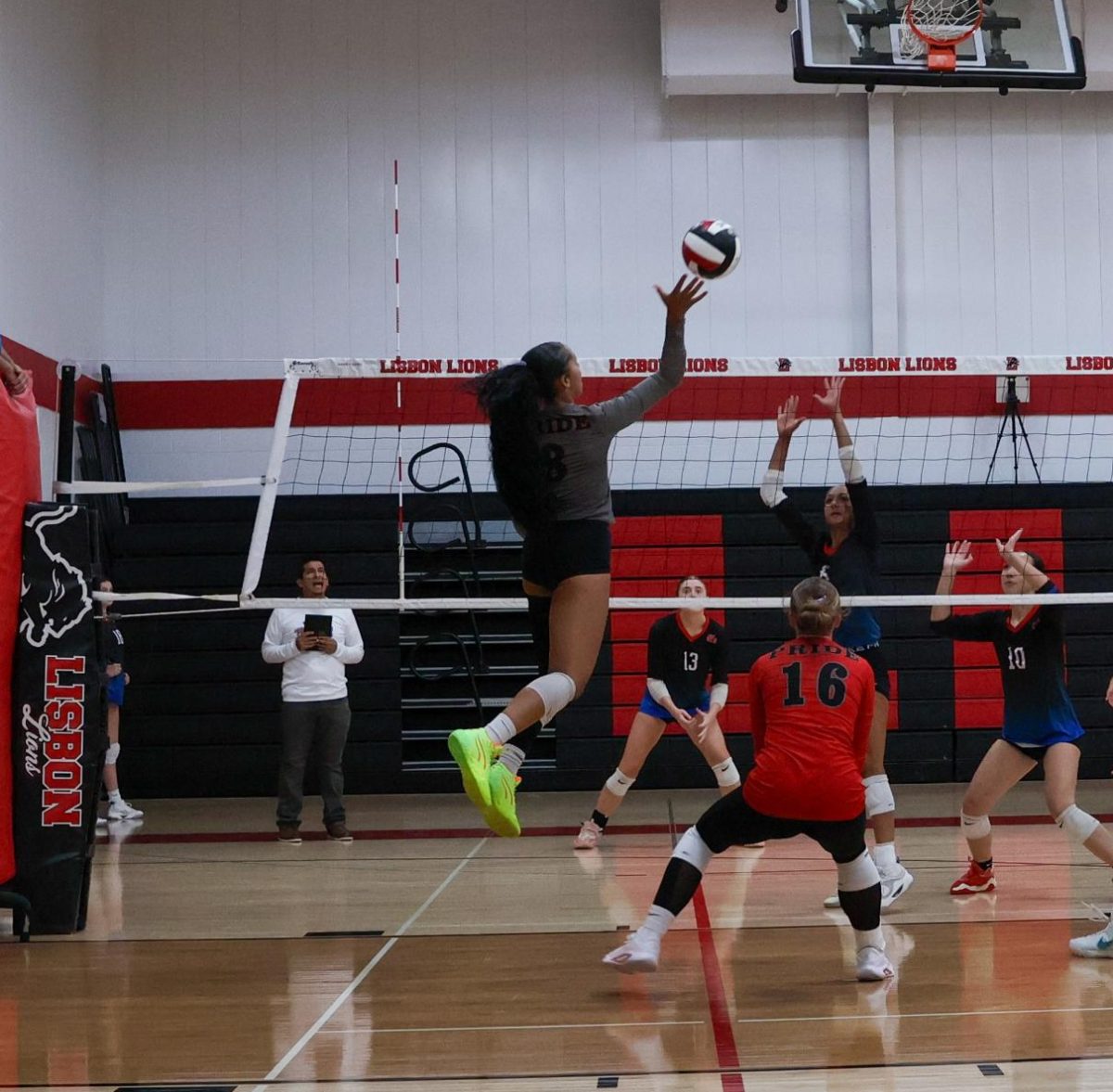 Lisbon senior Mykala Luzum-Selmon spikes the ball over the net, resulting in a kill. During the Lion’s game against Cedar Rapids Washington on September 11th Luzum-Selmon recorded a team high 12 kills.
