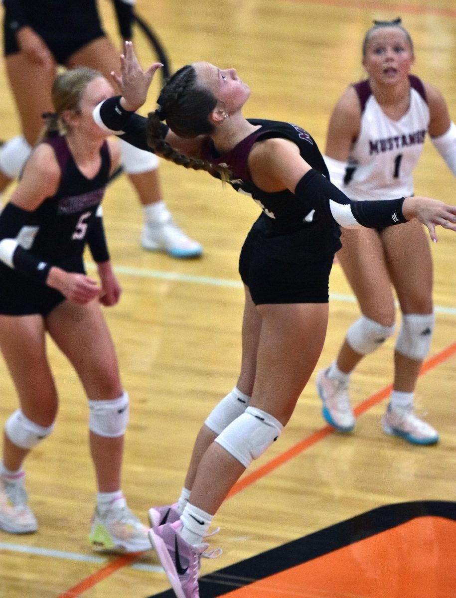 Lilly Cook unleashes a kill shot against the Lady Spartans Tuesday, Sept. 9 in Solon. The Mustangs fell 3-0 to their archrivals.