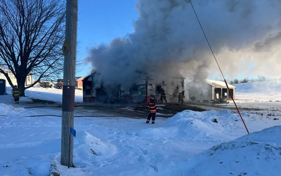 Firefighters from Lisbon work on putting out a machine shed fire at the Michael and Michelle Day residence in rural Lisbon, Sunday, Dec. 14. (Contributed)