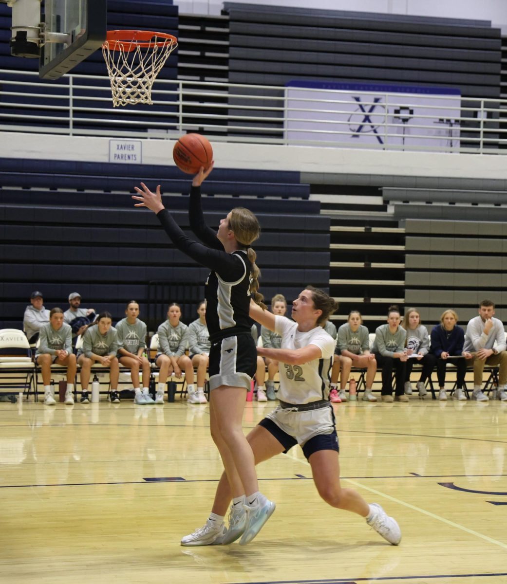 Rylee Rasmussen puts up the layup for the Mustangs against Xavier at Xavier High