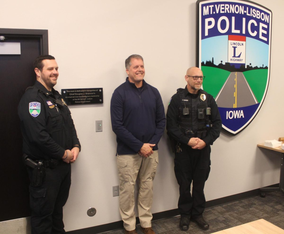 Mount Vernon-Lisbon Police chief Jason Blinks, former chief Doug Shannon and officer Todd Gehrke at the dedication of the training room.