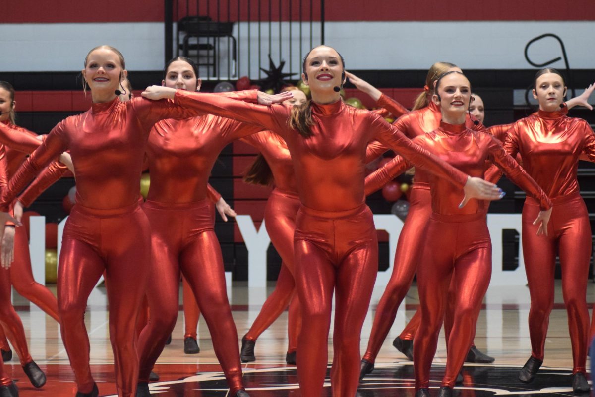 The dance team begins the showcase with their kick routine.