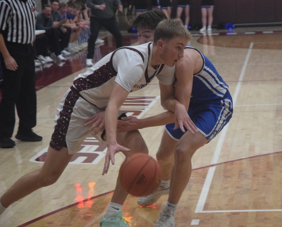 Mount Vernon’s Seth Rushford (No. 33) drives to the hoop after failing to find an open teammate against a Bondurant-Farrar defender in postseason play Monday, Feb. 23, at home.
