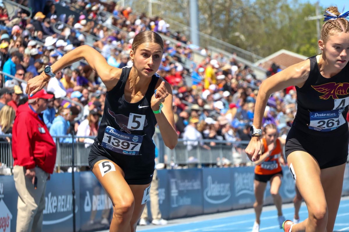 Mount Vernon’s Evelyn Moeller leads off the 4x 800 relay for the Mustangs at Drake.