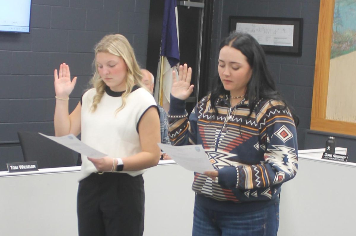 Morgan Kelley and Monet Roelle take oaths of office as new members of the Mount Vernon-Lisbon Police Department.