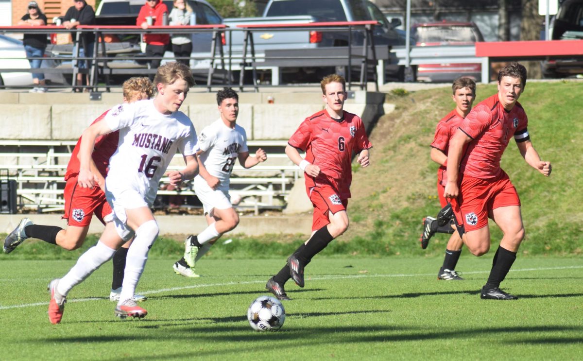 Mount Vernon sophomore Silas Johnson brings the ball through the West Branch defense during a match Saturday morning at The Little Rose Bowl in West Branch. Mount Vernon won, 5-0.