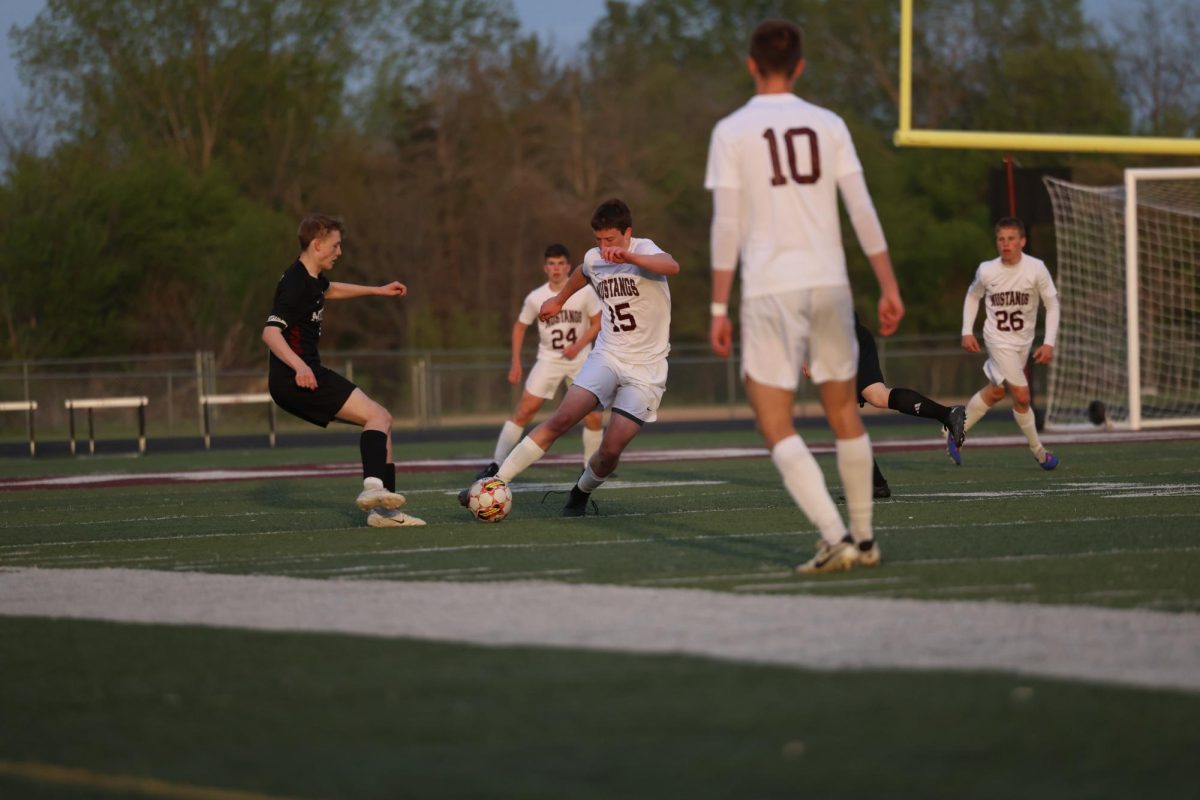Mount Vernon’s Isaac Dausener (No. 15) moves the ball down the field.