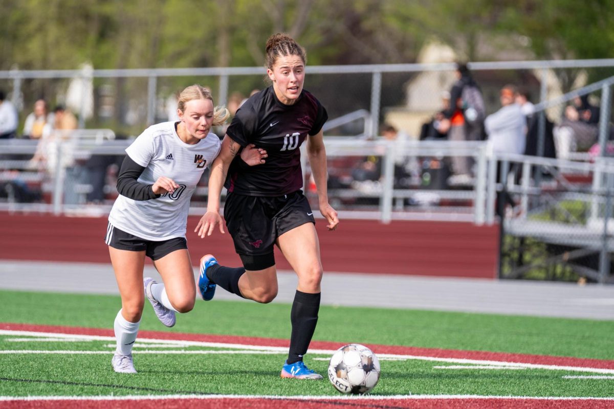 Mount Vernon forward Courtney Franck dribbles the ball during a girls soccer game between the Mount Vernon Mustangs and West Delaware Hawks at Mount Vernon High School on Thursday, April 30.