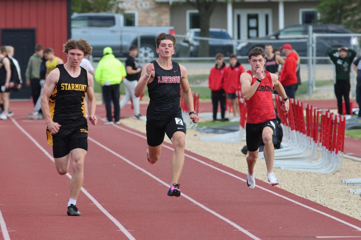 Lisbon’s Asa Bee and Kaden Martin compete in the 100 meter dash at Lisbon Thursday, May 7.