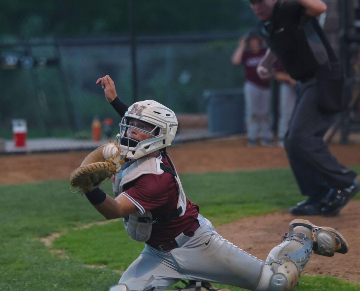 Mount Vernon catcher Gabe Grafft (No. 24) catches a pop up in play against Center Point Urbana.