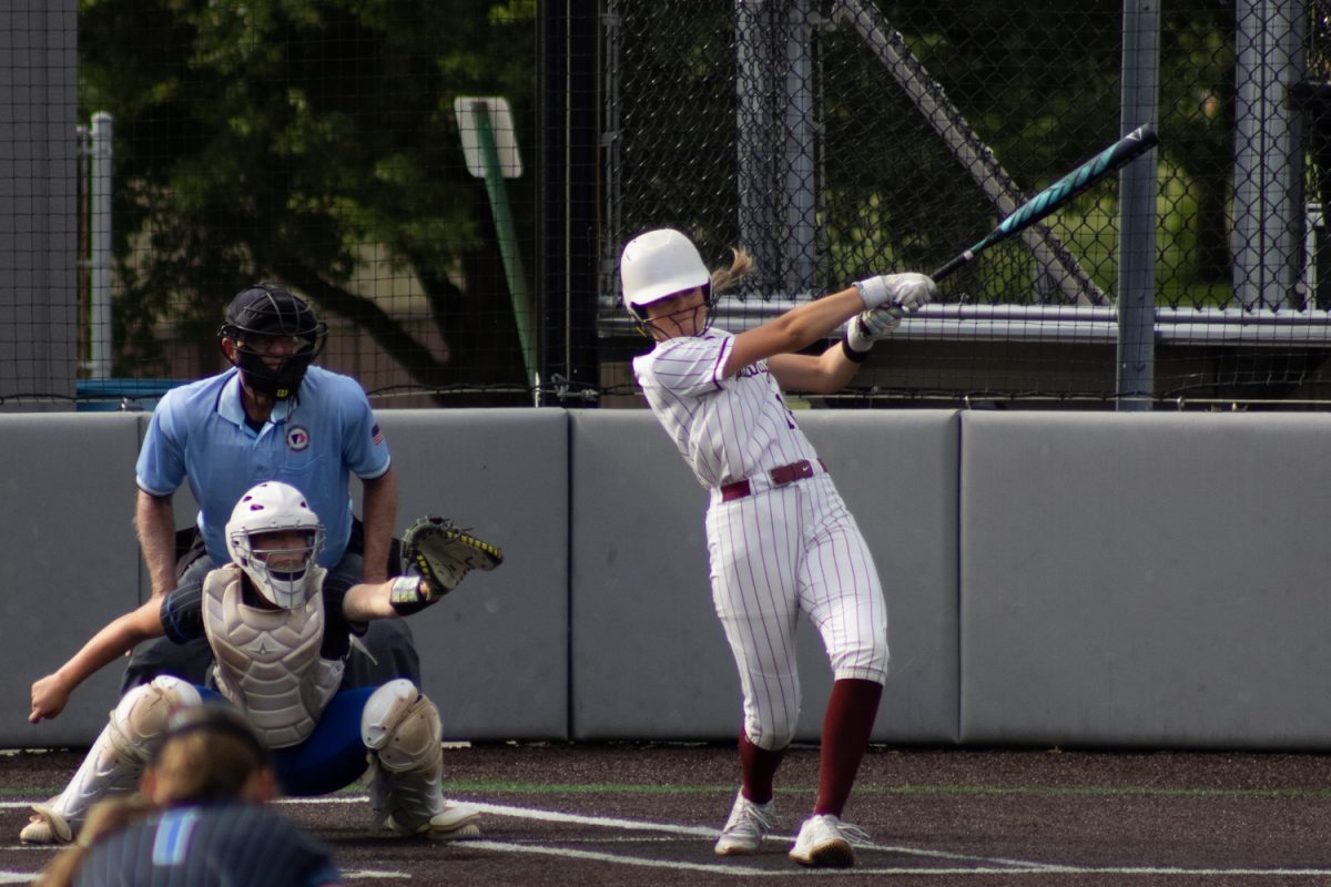 Brylee Bettcher swinging hard against Clear Creek Amana at Van Metre Family Softball Field on Monday, June 15.