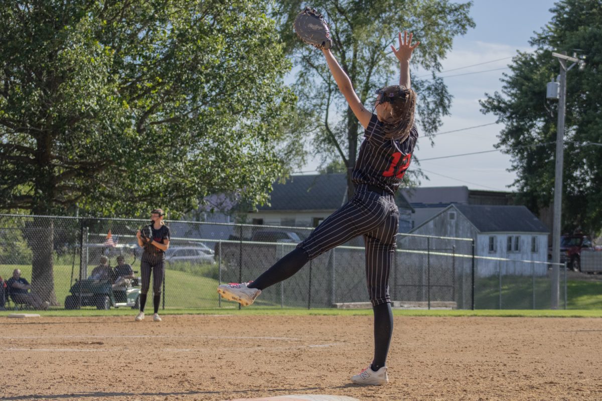 Alexa Roos celebrating a strike at first base against Marquette Catholic in Lisbon on Tuesday, June 16.