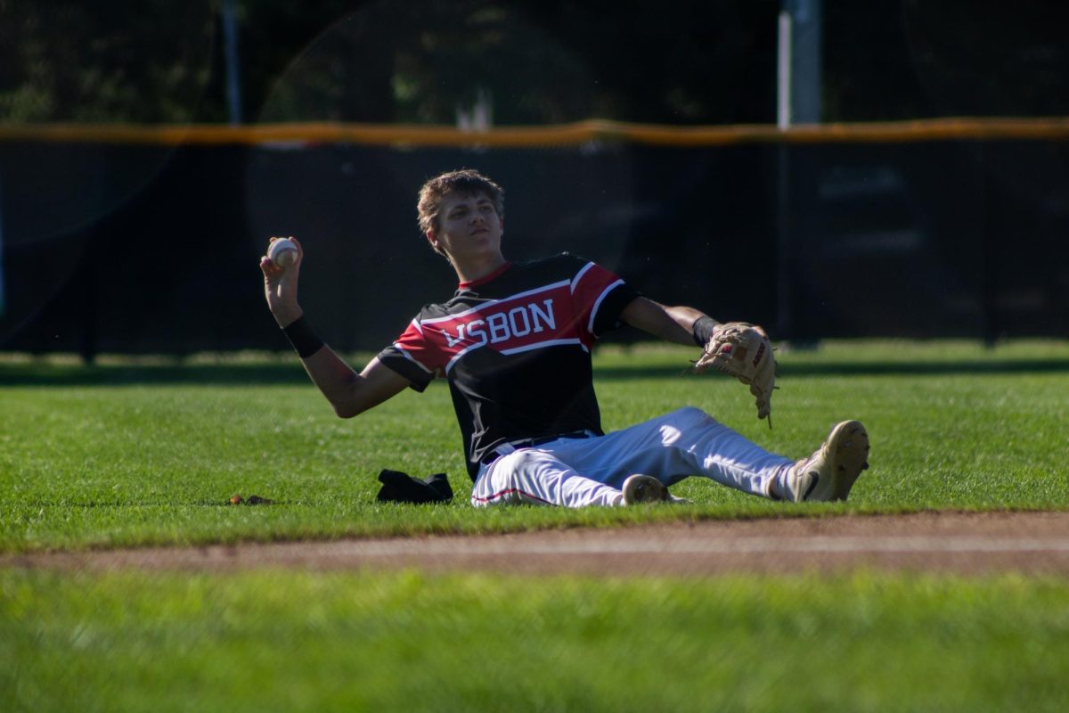 Lisbon shortstop Klayton Kahl throws back a caught ball in the third inning during a baseball game between the Lisbon Lions and East Buchanan Buccaneers at Bunting Ball Field in Lisbon earlier this season.