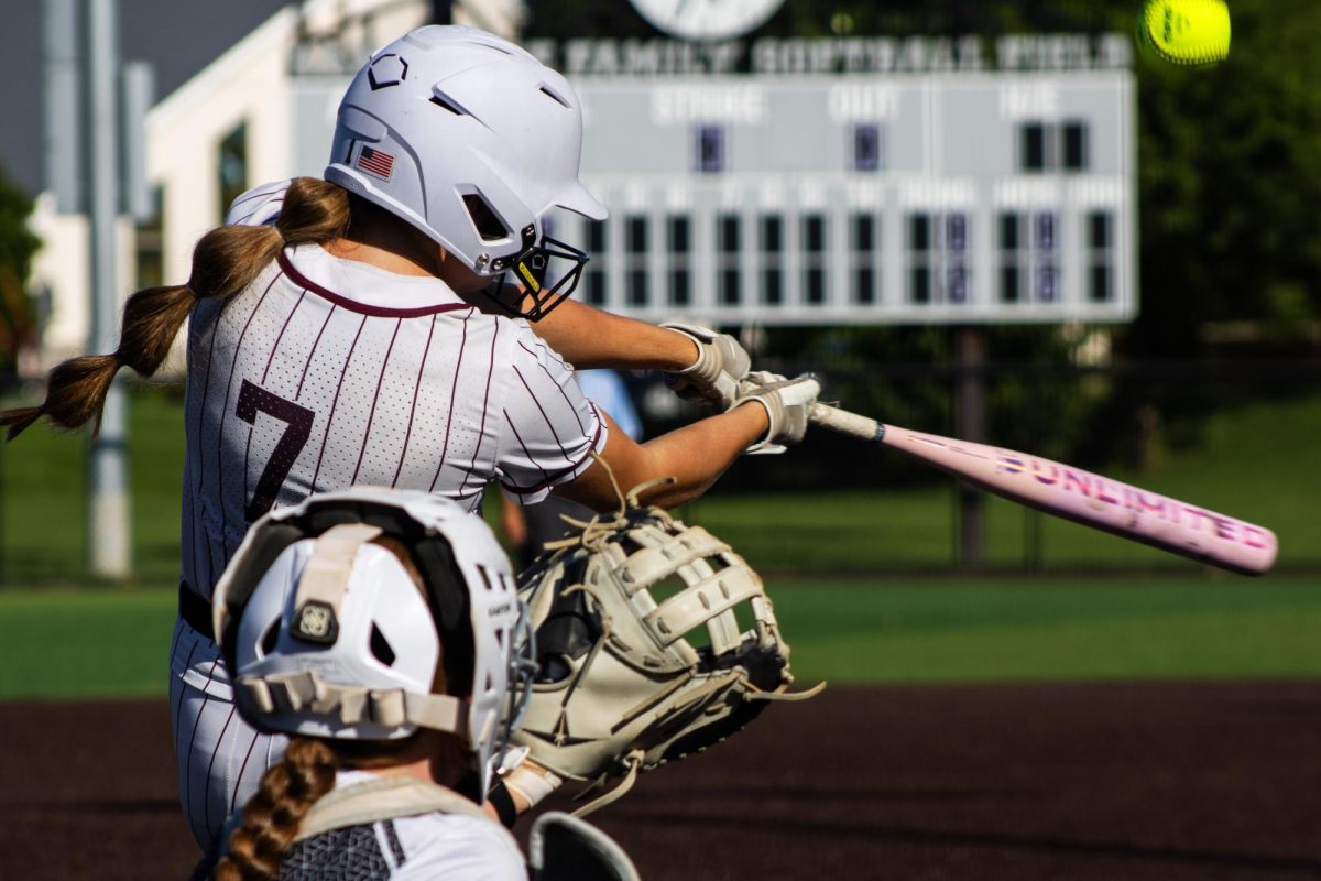 Mount Vernon center fielder Kinley Nissen bats the ball in the third inning during the first game in a softball double header between the Mount Vernon Mustangs and the Vinton-Shellsburg Vikings at Van Metre Family Softball Complex in Mount Vernon on Monday, June 22, 2026. The Mustangs beat the Vikings, 11-0.